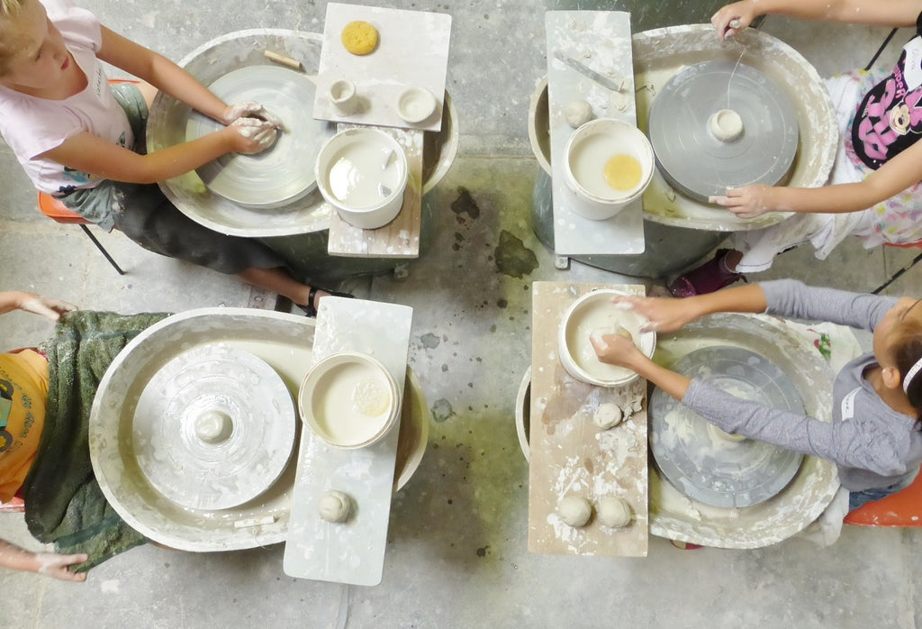 Kids try the wheel potterya